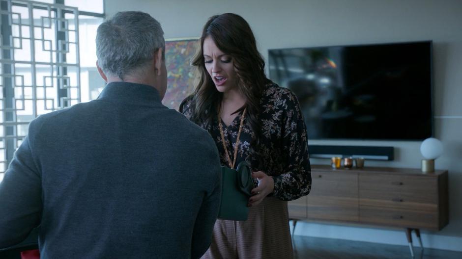 Al Bronson looks down at the fancy brain being presented to her by her uncle Stacey Boss.