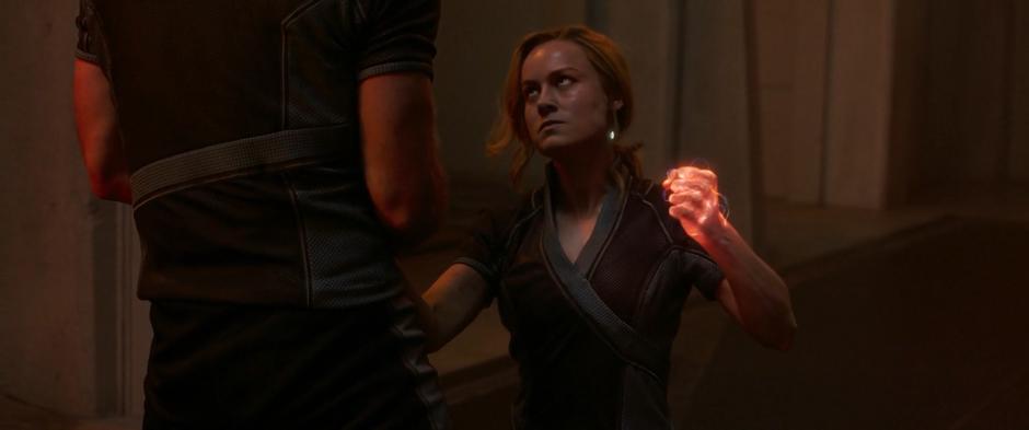 Vers holds up her glowing fist at Yon-Rogg after being thrown down.
