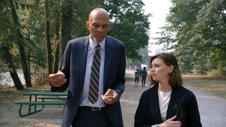 Zed tells Peyton his concerns about her plan while they walk through the park.