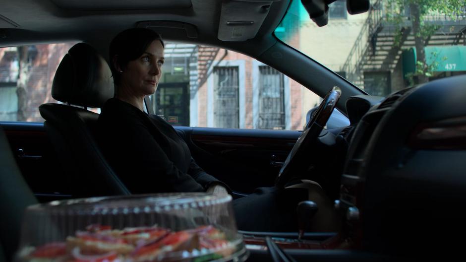 Hogarth sits in her car with her tray of bagels working up the nerve to go inside.