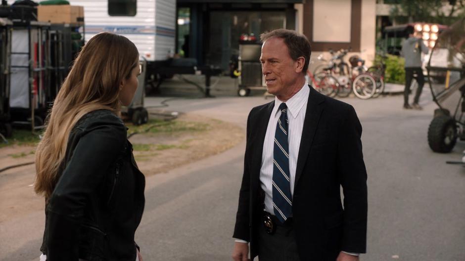 Chloe explains herself to her father outside her trailer.