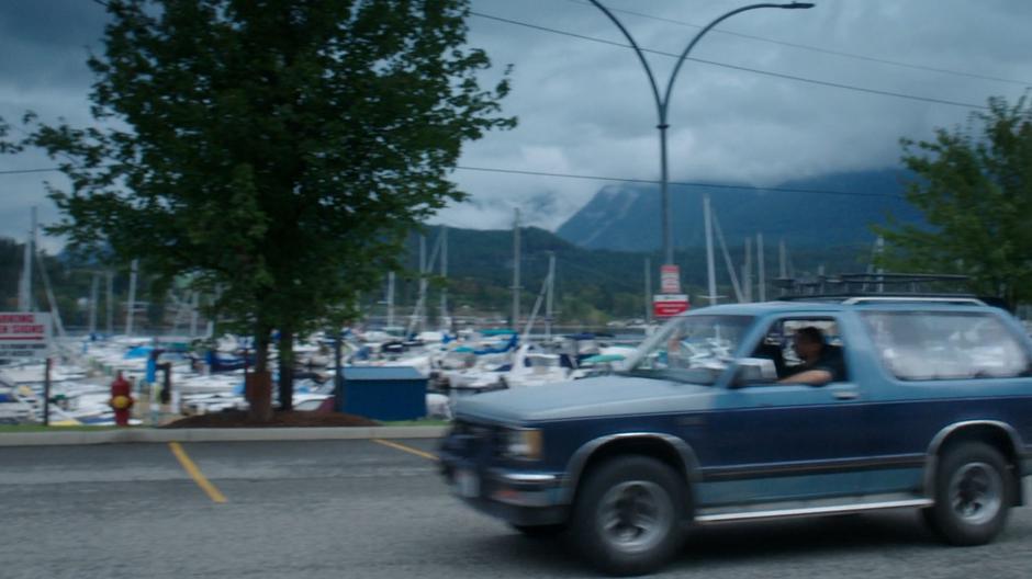 Ben drives past the marina with Levi.