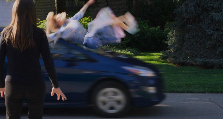 Stephanie jumps back when Darren hits Emily with his car.