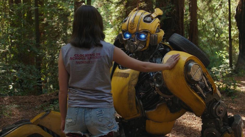 Charlie puts her hand on Bumblebee's shoulder after the recording finishes.