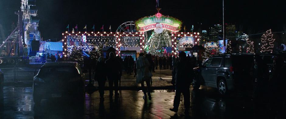 Billy follows his foster siblings as they run into the busy carnival at night.