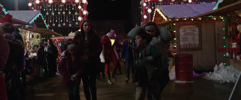 Billy walks back with Freddy while Darla, Mary, Eugene, and Pedro walk ahead of them into the carnival.