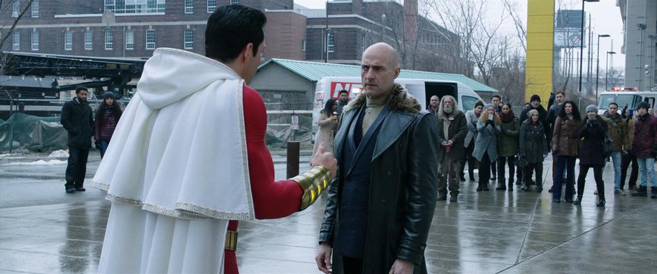 Billy tries to leave Sivana while they talk at the scene of the accident.