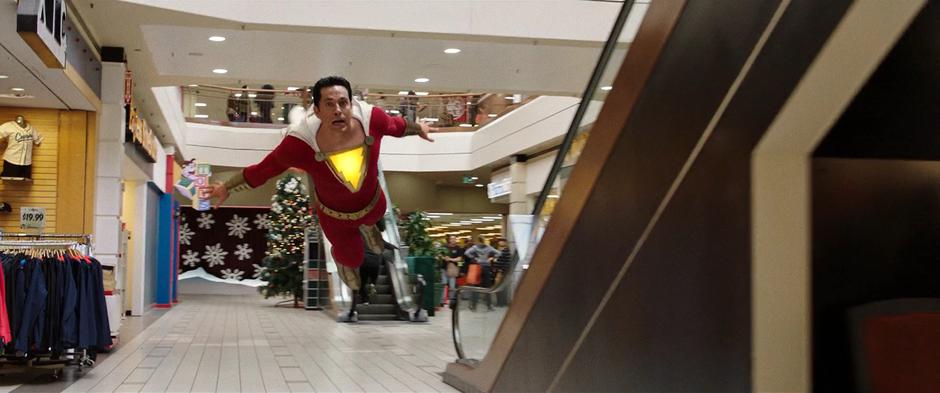 Billy tries to fly through the mall to escape Sivana.