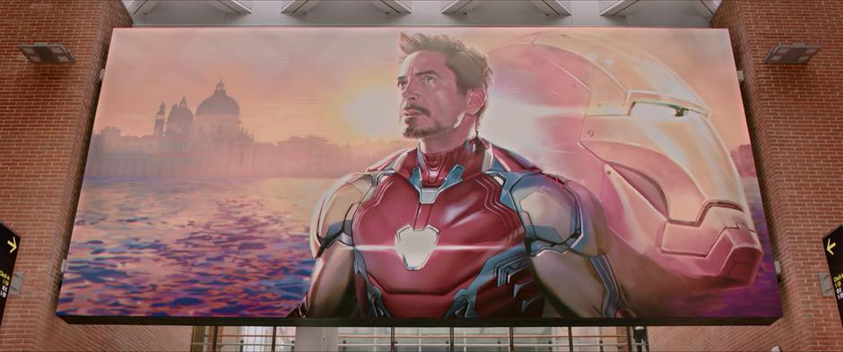 A large mural of Tony Stark as Iron Man hangs above the concourse.