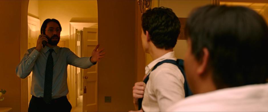Mr. Harrington comes out of his room to where Peter and Ned are talking excited to see Peter is alive.