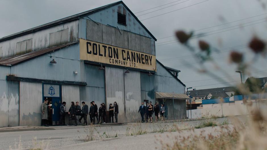 Demons line up and wait to go inside the club.