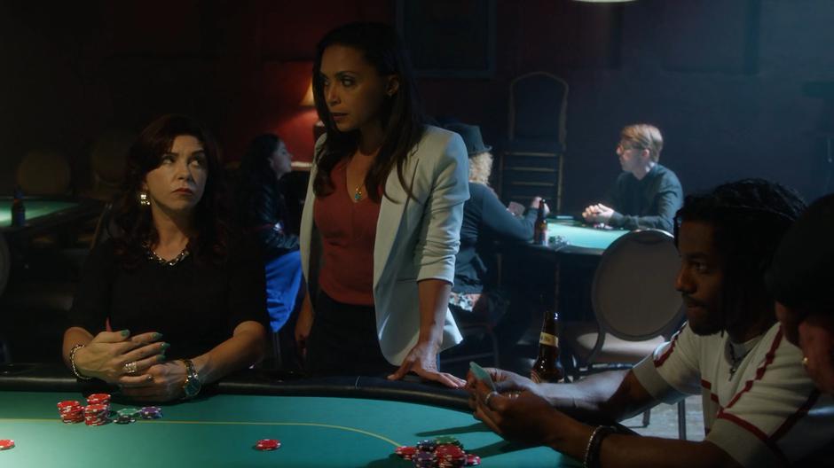 Debbie Dibny looks up at Cecile for her read on the other players at the table.