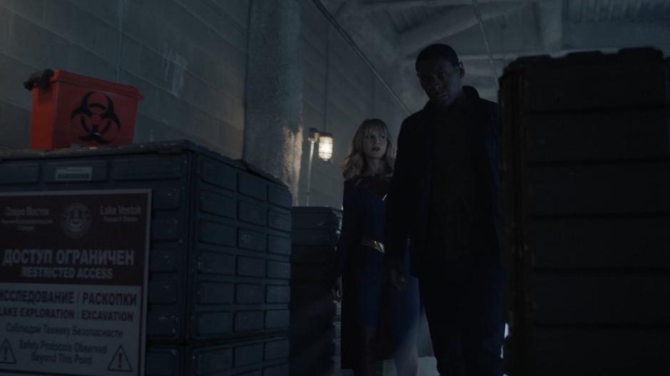 Kara and J'onn search through the facility for any sign of Rip Roar.