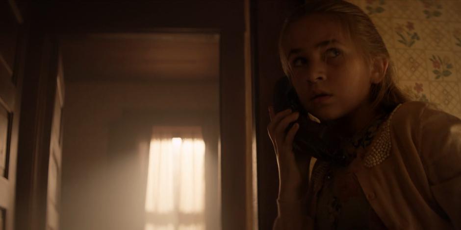 Beth looks around while calling her father for help.