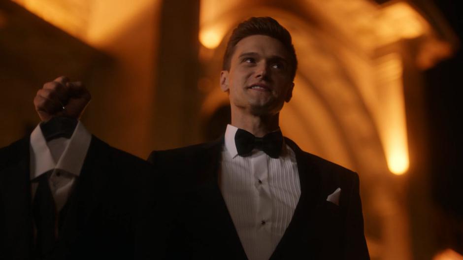 Ralph holds up a second tuxedo for Barry.