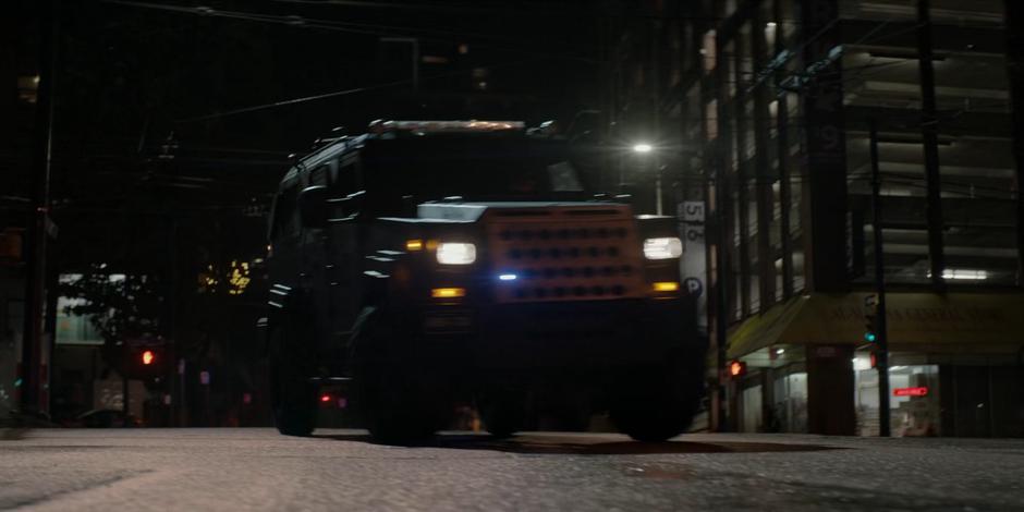 A Crows truck turns down the street near the sniper's nest and restaurant.