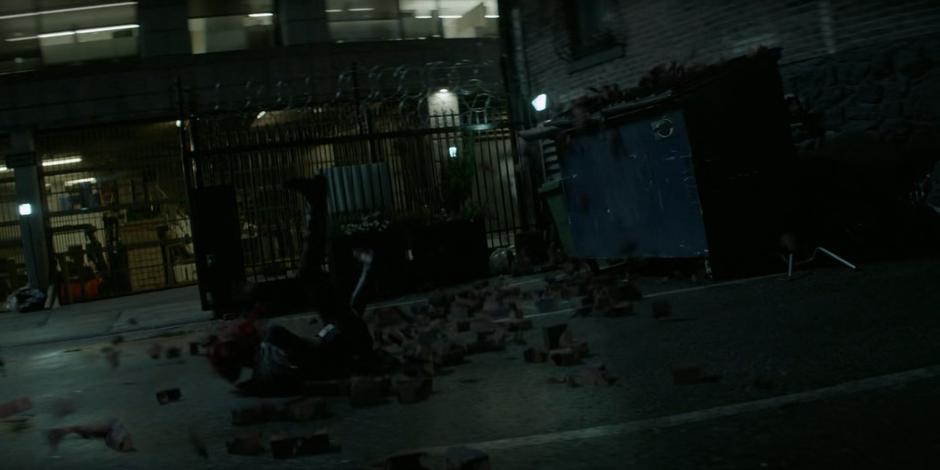 Julia Pennyworth smashes into the ground while disguised as Batwoman.