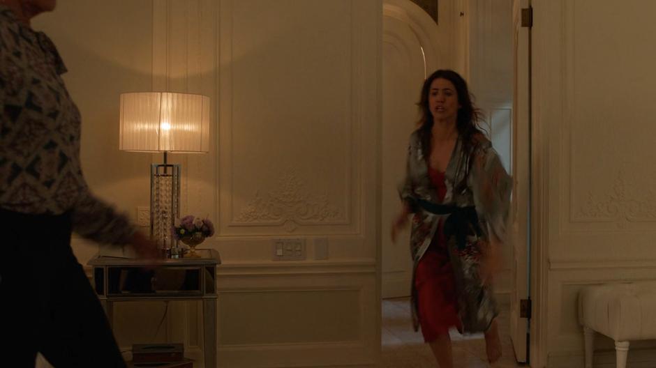 Andrea rushes in to the room where the Leviathan agents are attacking Russell.