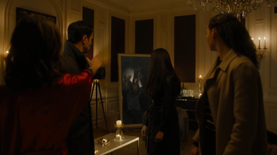 Harry, Maggie, and Macy turn as Abigael reveals an image of Parker in her mirror.