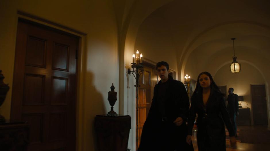 Parker and Maggie walk down the hallway after the punishment.
