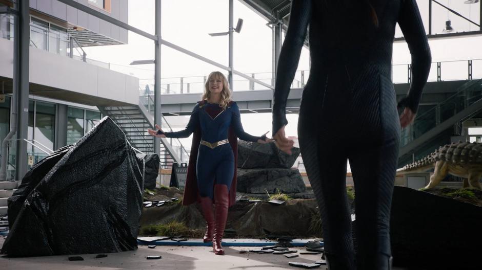 Kara walks over to J'onn and Andrea after trapping Rama Khan in the tar pit.