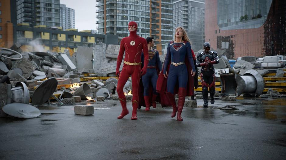 Barry and Kara look up at the Spire looming above as they approach with Clark, Kate, and Ray.