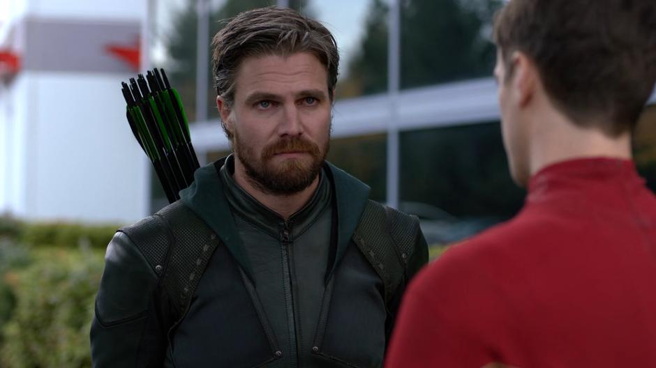 Oliver listens to Barry's story with an increasingly angry look.