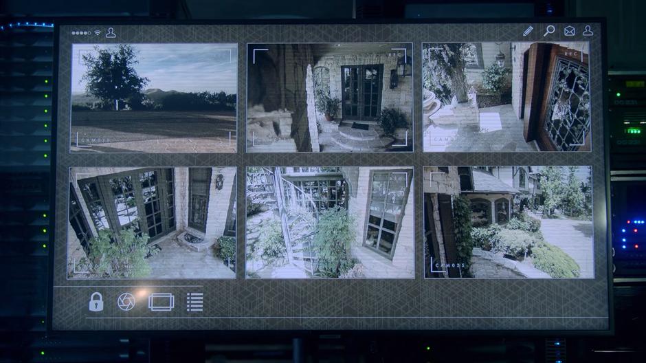 Security cameras show various views around the mansion.