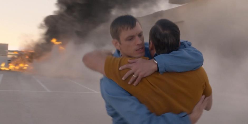 Ed hugs Gordo to stop him from running towards the flaming debris of the LLTV.