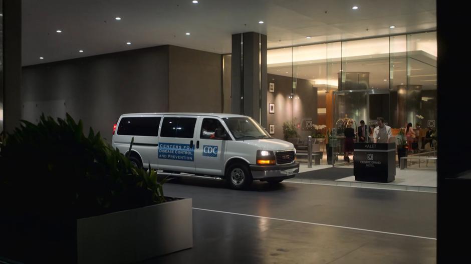 The church van diguised as a CDC van pulls up in front of the valet stand.