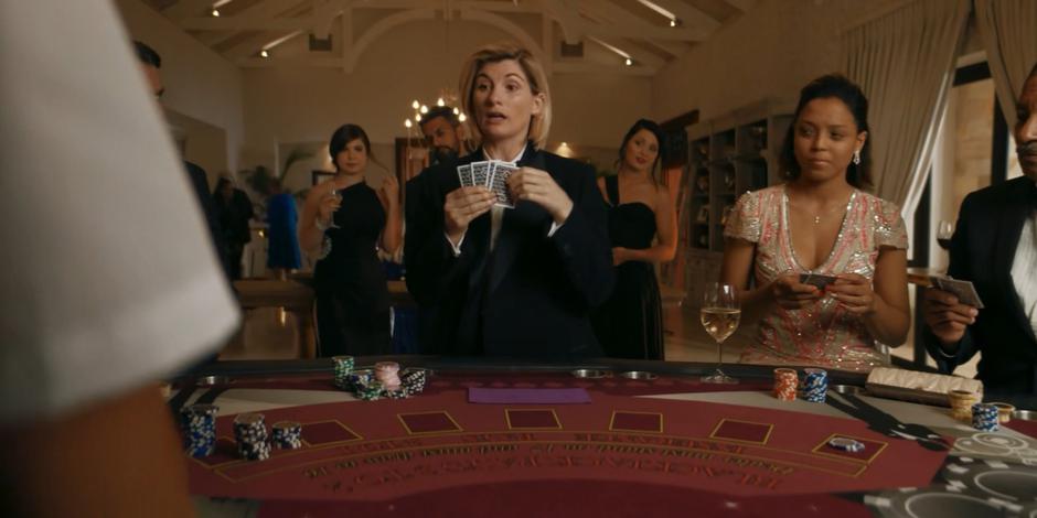 The Doctor plays a card game that she doesn't know the rules of.