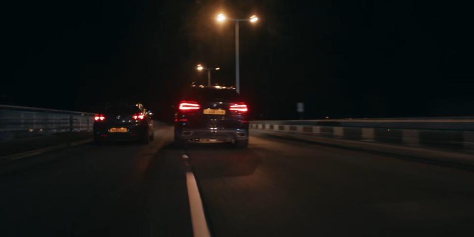 The government vehicle drives itself out onto the bridge.