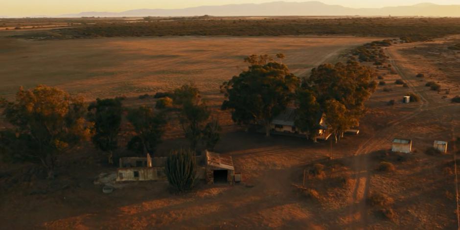 Aerial establishing shot of O's cabin in the outback.