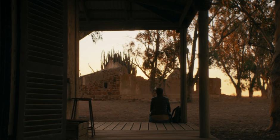Yaz sits on the porch looking out at the sunrise and thinking of what happened to her.