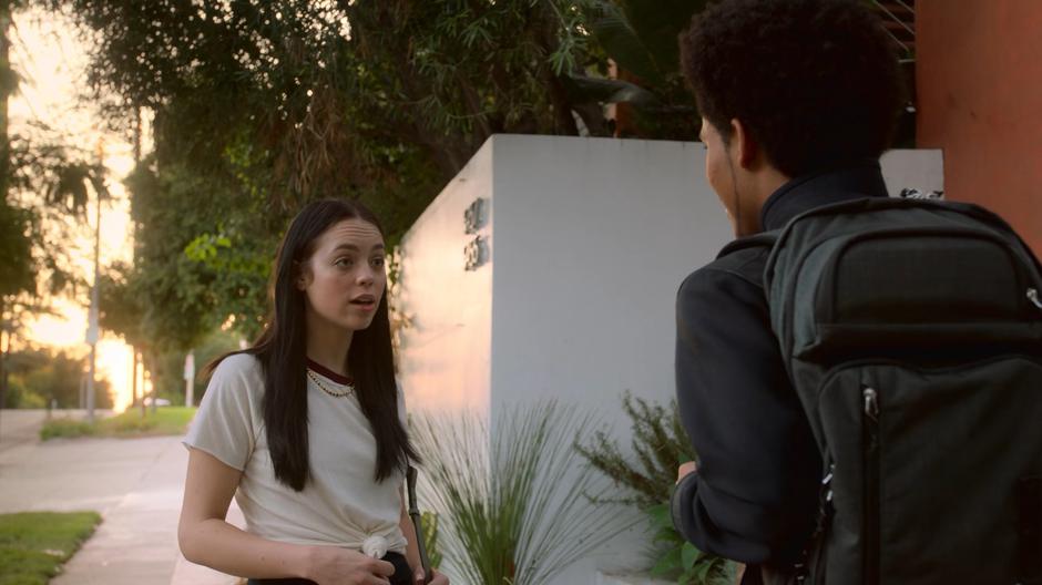 Julie tells future Alex that he can come back later when Karolina is home.