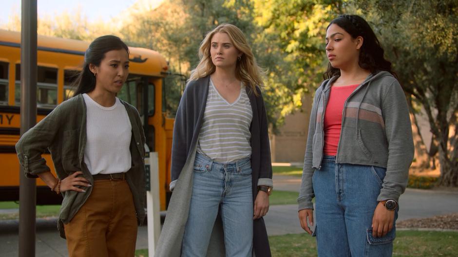 Nico, Karolina, and Molly stand around outside the bus after capturing future Alex.