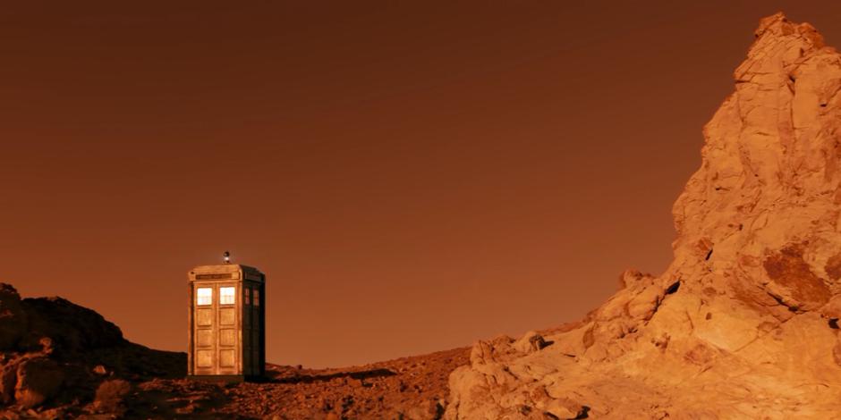The TARDIS materializes on the red Gallifrey landscape.