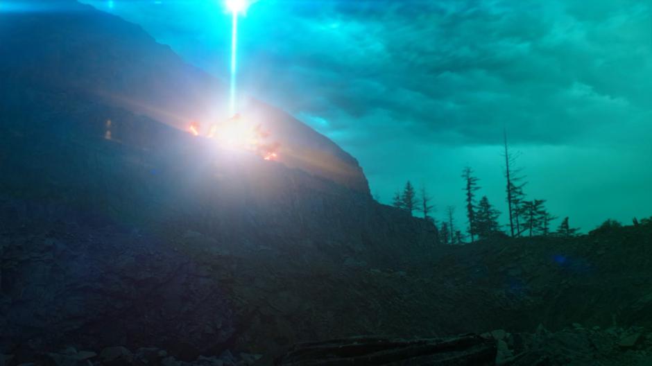 A light fires into the sky from where Oliver and the Anti-Monitor are battling to recreate the universe.