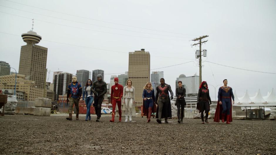 Rene, Nia, Diggle, Barry, Sara, Kara, J'onn, Alex, Kate, and Clark walk into the lot to face off against the shadows.