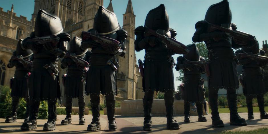 A platoon of Judoon teleport into the plaza in front of the cathedral.