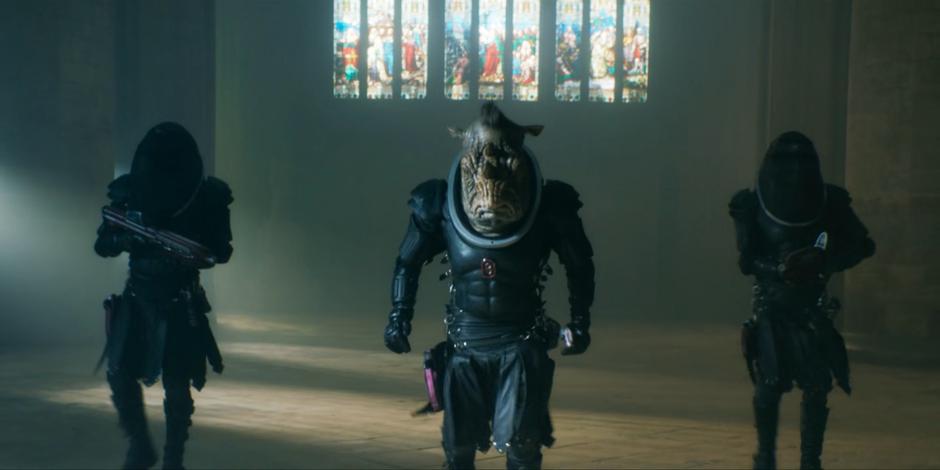Pol-Kon-Don approaches Ruth and the Doctor flanked by two Judoon soldiers.