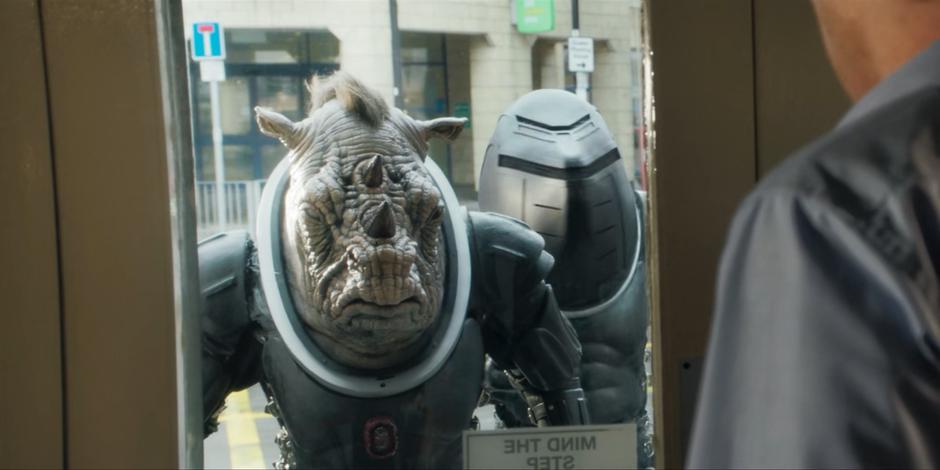 Allan walks over to the door to see Pol-Kon-Don and the other Judoon soliders outside.