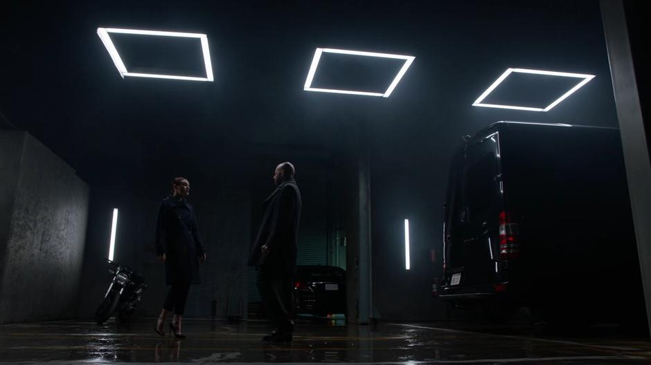 Lena approaches Lex as he exits his van to confront him about missing their meeting.