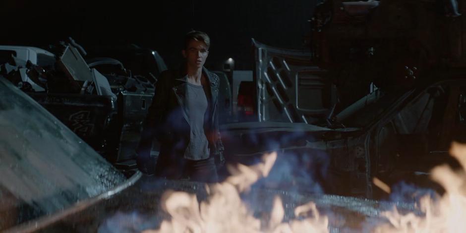 Kate watches as the car containing the two hostages and Beth is lit on fire.