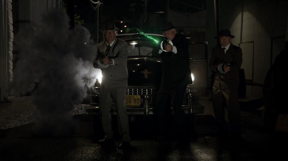 Bugsy's magic bullet flies between the gangsters turning them into smoke.