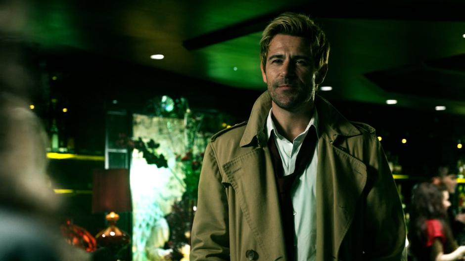 Constantine smiles down at Astra as he approaches her in her club.