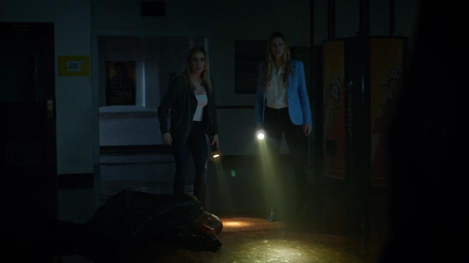 Sara and Ava stand over Mick's burned body as the killer's identity is revealed.