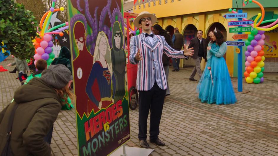 Gary calls out for people to attend the Heroes vs. Monsters show while Nora messes with her new fairy godmother outfit.