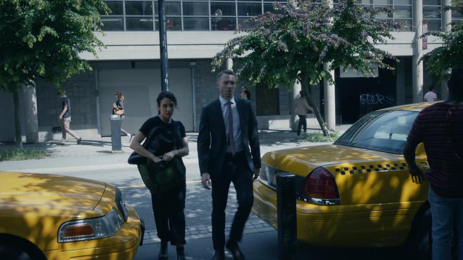 Kady and Pete cross the street to investigate the empty lot.