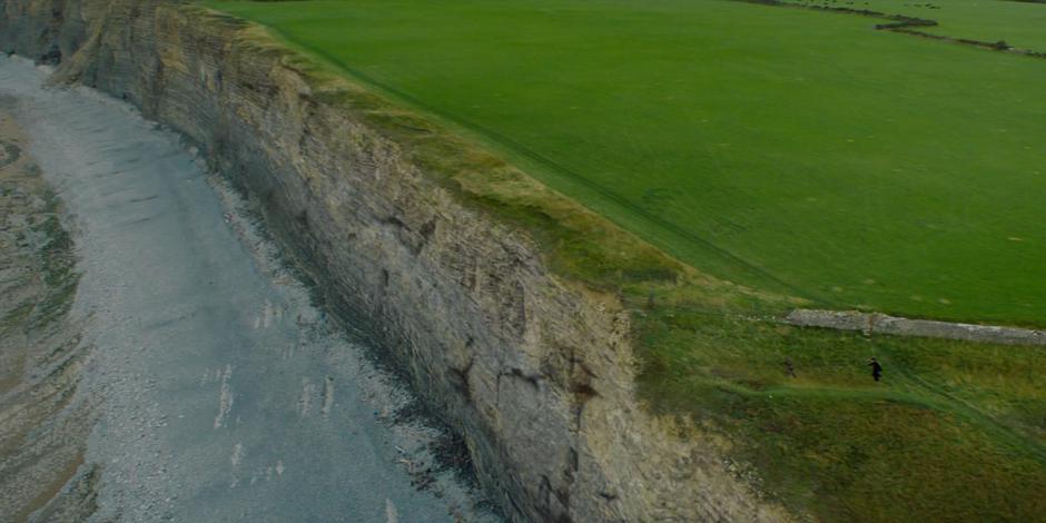 Brendan chases a criminal to the edge of the cliff.